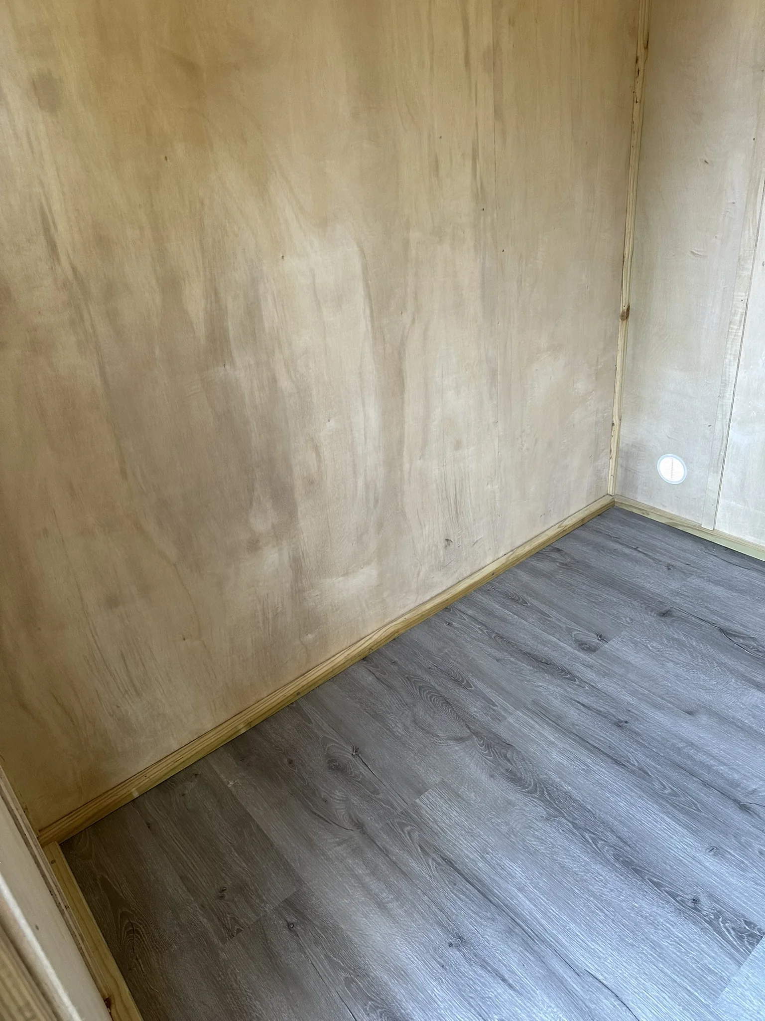 Custom-built shed vinyl flooring and finished walls
